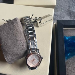 Burberry brand new watch with tag. Paid over 1700. Beautiful watch .